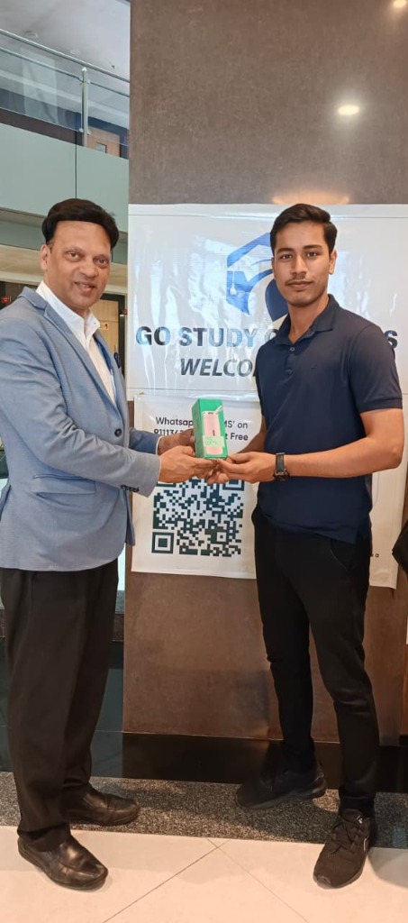 Founder Amit Bukharia presenting student departure gift
